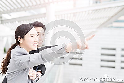 Businesspeople show something in office Stock Photo