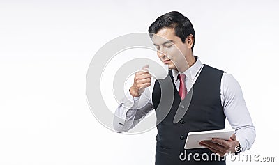 Businesspeople successful technology communication concept. Confident positive handsome businessman drinking cup of coffee or tea Stock Photo