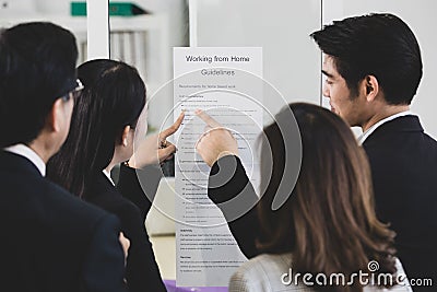 Businesspeople surrounded the placard board Stock Photo