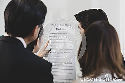 Businesspeople surrounded the placard board Stock Photo