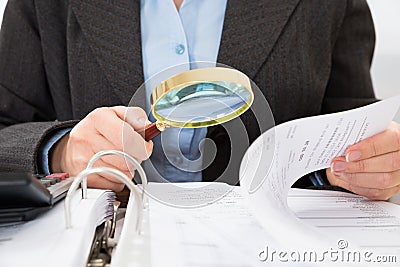 Businessperson checking bills Stock Photo