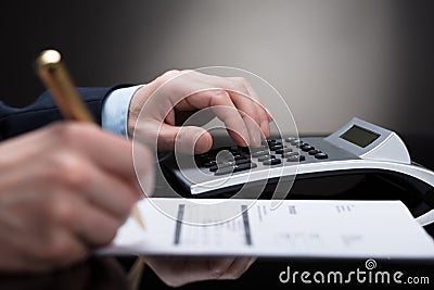 Businessperson Checking Invoice Stock Photo