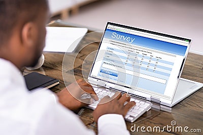 Businessperson Filling Online Survey Form Stock Photo