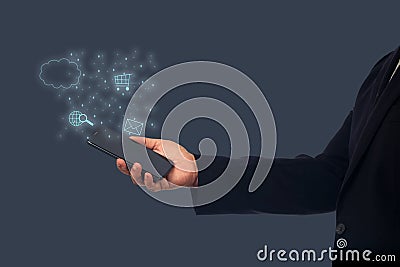 A Businessperson Hand Holding Mobile Phone With shopping Online ,payment Stock Photo