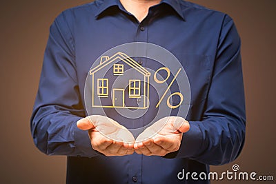 Businessperson hands holding abstract glowing house sketch on dark background. Real estate concept Stock Photo