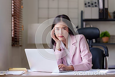 Businessperson have anxiety and stress and pressure with many financial document paperwork on desk, deadline, upset Stock Photo