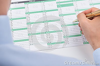 Businessperson Marking On Calendar Stock Photo