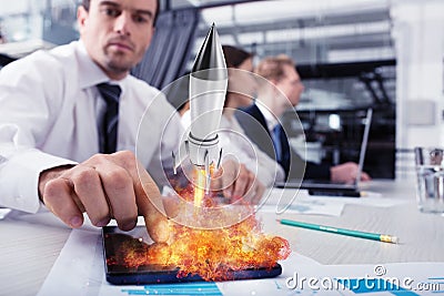 Businessperson in office work for a startup of a company with a rocket Stock Photo