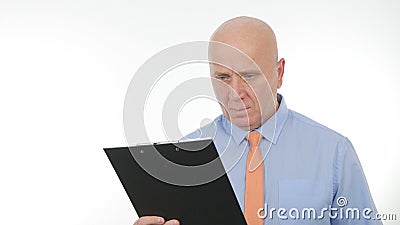 Businessperson Read and Compare Documents from a Clipboard Stock Photo