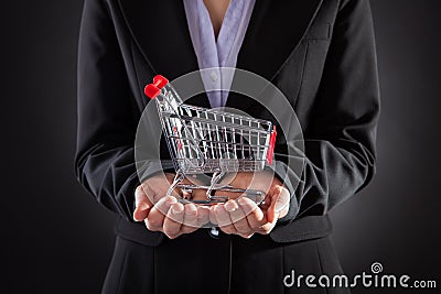 Businessperson With Shopping Cart Stock Photo