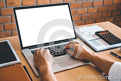 Businesss man using laptop with blank screen in the office Stock Photo