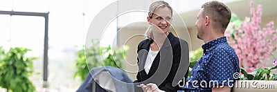 Businesswoman and businessman communicate and discuss business project Stock Photo