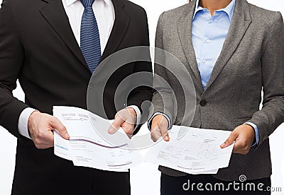 Businesswoman and businessman with files and forms Stock Photo