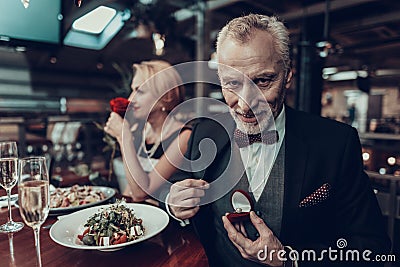 Businessman wants give ring to his Woman Stock Photo