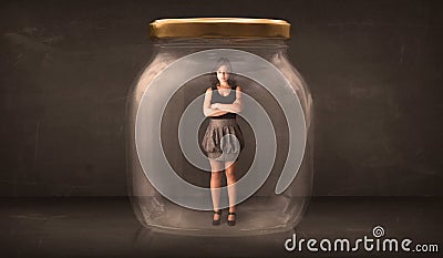 Businesswoman captured in a glass jar concept Stock Photo