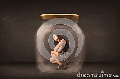 Businesswoman captured in a glass jar concept Stock Photo