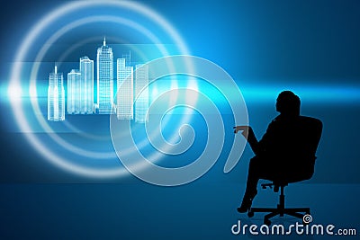 Businesswoman in chair with virtual city Stock Photo