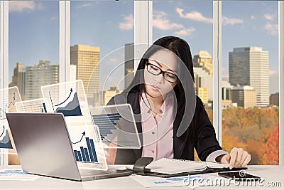 Businesswoman with chart and reminder book Stock Photo