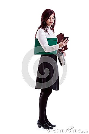 Businesswoman checking mails on her smartphone Stock Photo