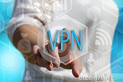 The businesswoman chooses button VPN, Virtual Private Network on the touch screen with a futuristic background Stock Photo