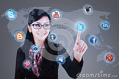 Businesswoman click on social media Editorial Stock Photo