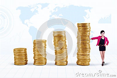 Businesswoman and coins chart Stock Photo