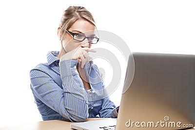 Businesswoman concentrating on her laptop Stock Photo