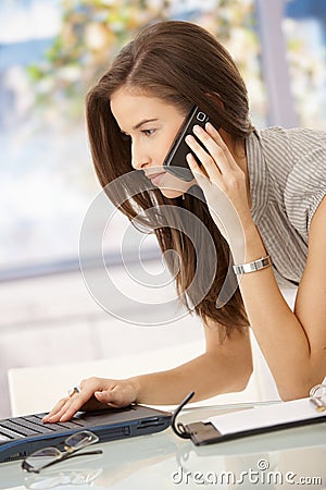 Businesswoman concentrating on work Stock Photo