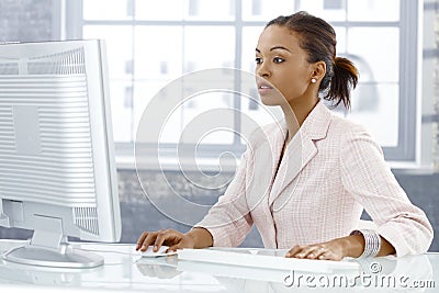 Businesswoman concentrating on work Stock Photo