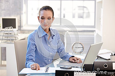 Businesswoman concentrating on work Stock Photo