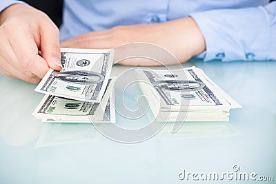 Businesswoman counting bank note Stock Photo