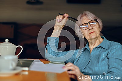 A businesswoman documents work sheet of paper and pen Freelancer works unaltered Stock Photo