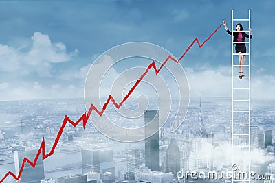 Businesswoman drawing graph Stock Photo