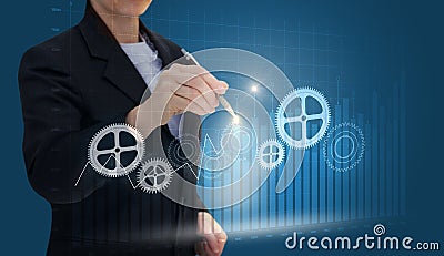 Businesswoman draws gears . Stock Photo