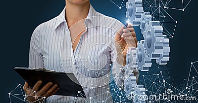 Businesswoman draws a mechanism . Stock Photo