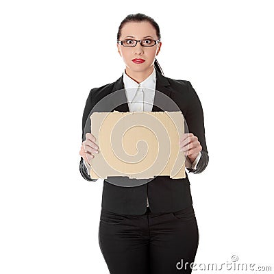 Businesswoman with empty cardboard sign Stock Photo