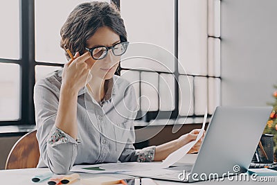 Businesswoman in glasses feeling tired, suffering from eye strain and fatigue during computer work Stock Photo