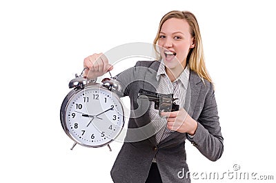 Businesswoman in gray suit holding alarm clock Stock Photo