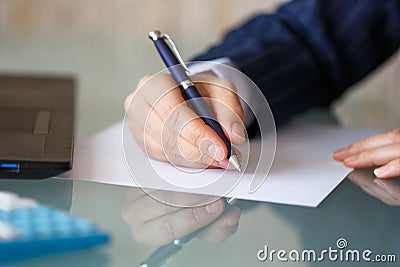 Businesswoman hand write on blank paper Stock Photo