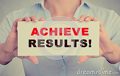 Businesswoman hands holding card sign with achieve results message Stock Photo