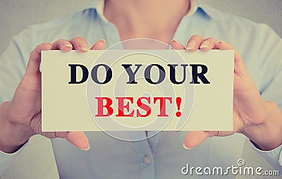 Businesswoman hands holding sign with do your best message Stock Photo