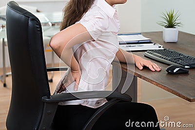 Businesswoman Having Backpain Stock Photo