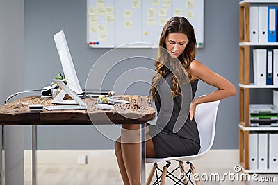 Businesswoman Having Backpain Stock Photo
