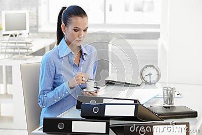 Businesswoman having coffee break Stock Photo