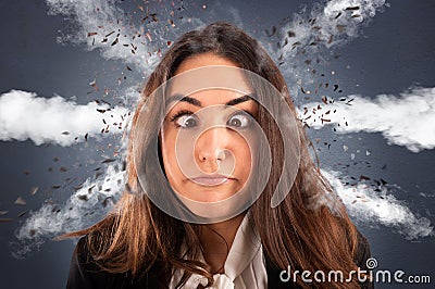Businesswoman with head ready to explode due to stress and overwork Stock Photo