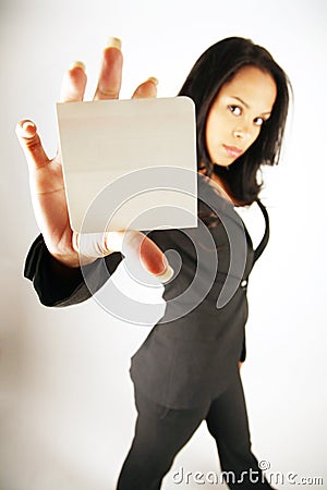 Businesswoman holding card Stock Photo