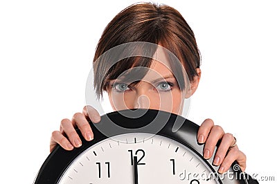 Businesswoman holding a clock Stock Photo