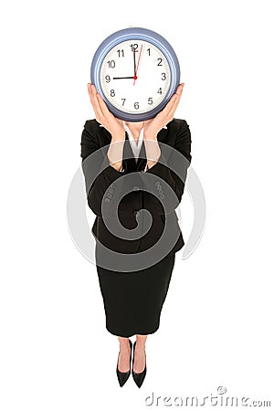 Businesswoman holding clock Stock Photo