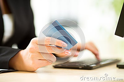 Businesswoman holding credit card on laptop for online payment concept Stock Photo