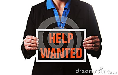 A businesswoman holding a help wanted sign. Stock Photo